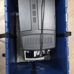 Vollautomaten vorsichtig hineinheben